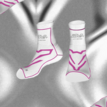 White socks with pink designs and 'Gold Coast' branding on a reflective silver background